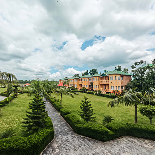 Front Image Of Resort With Lush Green Lawn